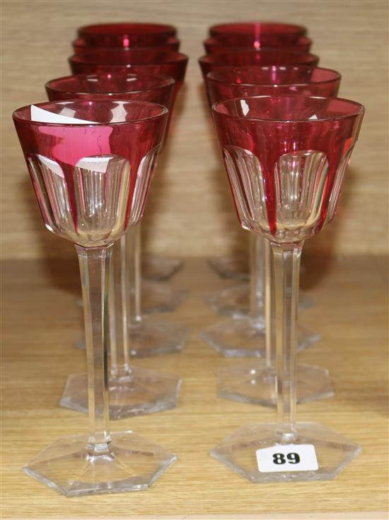 A set of ten cranberry overlay glasses height 19cm